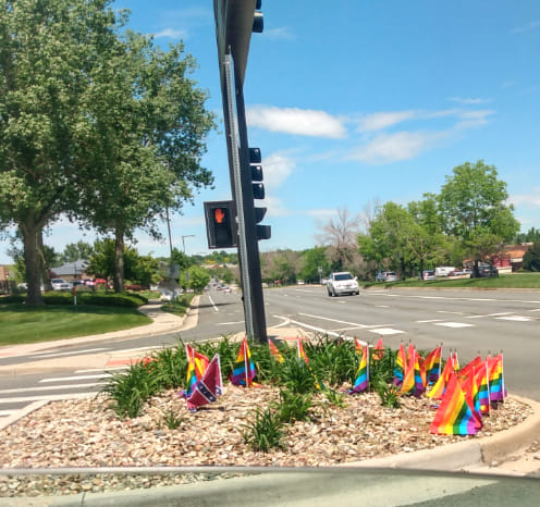 Pride flags in the ground with one confederate flag